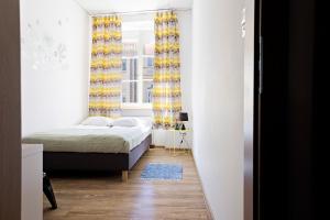 Posteľ alebo postele v izbe v ubytovaní Folk Hostel