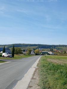 an empty road in the middle of a town at Bulles de Lune in Sacy