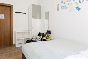 Posteľ alebo postele v izbe v ubytovaní Folk Hostel