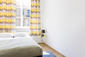 Posteľ alebo postele v izbe v ubytovaní Folk Hostel