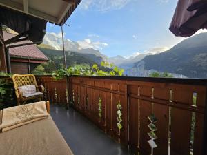 a balcony with a view of the mountains at Chalet Aargovia South in Wengen