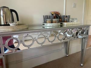 a metal counter top with a bunch of pans at The Jasmine Suite in Newark upon Trent