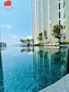 a swimming pool in the middle of a building at The Shore Maison Life 小居屋 in Kota Kinabalu