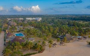 an aerial view of a resort with a pool and palm trees at Ocean Beach Resort & SPA in Malindi