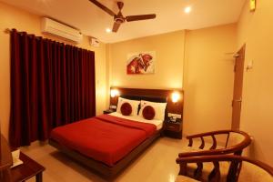 Rúm í herbergi á Hotel Nakshatra Inn VL Tuticorin