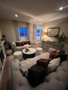 a living room with a couch and a table at Luxury apartment, 60 High St, St Martins in Lincolnshire