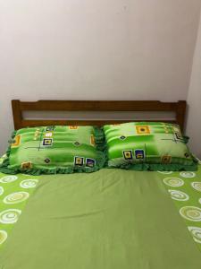 Ένα ή περισσότερα κρεβάτια σε δωμάτιο στο Cg Homestay