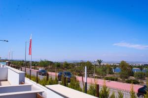 a view from the balcony of a house at Beautiful Condo in Laguna Beach Resort overlooking Laguna Rosa In Torrevieja With 2 Bedrooms and 2 Bathrooms in Torrevieja