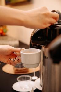 Comodidades para preparar café e chá em Hotel Carrera