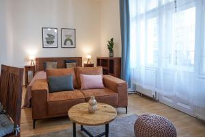 a living room with a couch and a bed at Narodni - Old Town Residence in Prague +85 photos