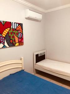 Postel nebo postele na pokoji v ubytování Aconchego do Mar