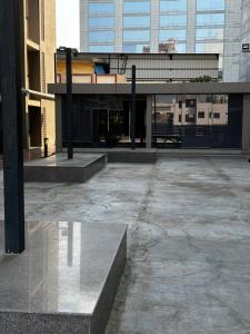 an empty parking lot in a city with buildings at River Front Property in Ahmedabad