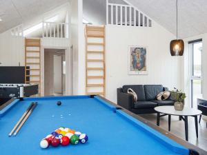 a living room with a pool table at Luxury Retreat with Pool - By Traum Ferienwohnungen in Kongsmark