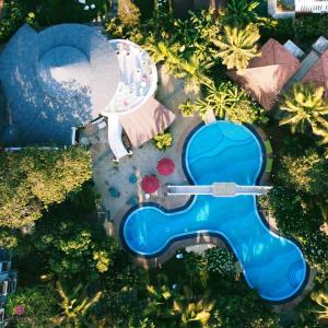 an overhead view of a pool in a resort at Sashas Holiday Village in Vagator