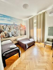 a bedroom with two beds and a view of a city at Bovisa House B&B private rooms in Milan