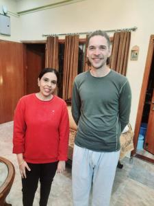 a man and a woman standing in a room at Beena Homestay in Jaipur