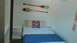Un pat sau paturi într-o cameră la Segunda Casa- Seu cantinho na Praia do Morro em Guarapari - Quartos suítes 2 até 4 pessoas