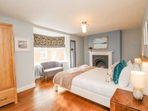 En eller flere senge i et værelse på Bay Cottage