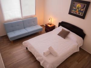 Llit o llits en una habitació de Las Casitas en Miraflores Guayaquil