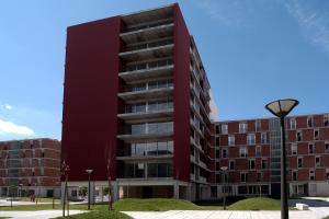 an apartment building with a red building at Cardoso Pires 2 Bedrooms Apt. in Lisbon +9 photos