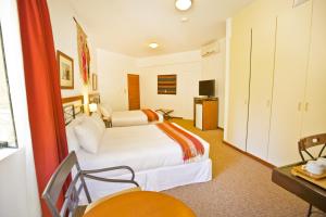 Postel nebo postele na pokoji v ubytování Tierra Viva Machu Picchu Hotel