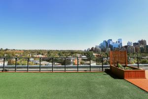 a balcony with a view of the city at Vibrant & Modern Loft-style Walkout Near LRT in Calgary