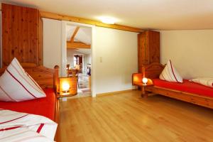 a large room with two beds and a mirror at Villa Maria Wohnung 10 in Ostseebad Koserow