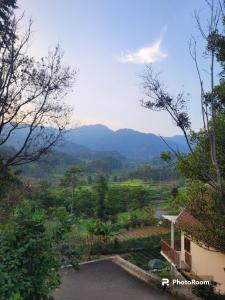 a view of the mountains from a house at Villa Bumisoka in Purwakarta