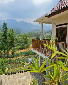 a house with a balcony with a view at Villa Bumisoka in Purwakarta