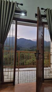 an open door to a balcony with a view at Villa Bumisoka in Purwakarta