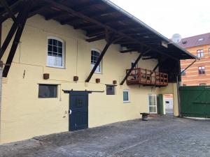 a large building with a door and a balcony at Ferienhaus Staßfurt in Staßfurt