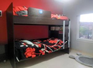 a bunk bed with a laptop on top of it at Amanecer serrano in Tanti