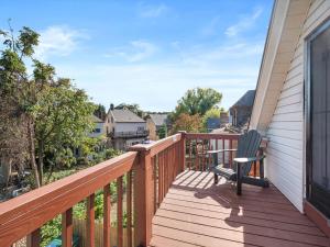 a wooden balcony with a rocking chair on it at Shadyside, Pittsburgh, Modern and Stylish 1 Bedroom Unit5 with Free Parking in Pittsburgh