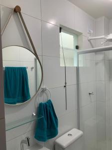 a bathroom with a shower and a mirror at Aconchego do francês - Praia do Francês - Alagoas/Maceio in Marechal Deodoro