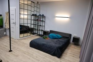 a bedroom with a bed and a large mirror at Romantic Room Šiauliai in Šiauliai