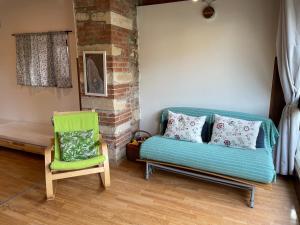 a living room with a couch and a chair at Il Nido della Buonanotte 2 KIDS friendly in Verona