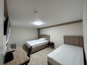 Katil atau katil-katil dalam bilik di Rheinischer Hof Appartements