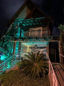 a building with a sign that reads los angelesada at Olidal Pousada da Serra in Gramado