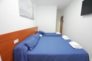 Postel nebo postele na pokoji v ubytování Hotel Tres Leones