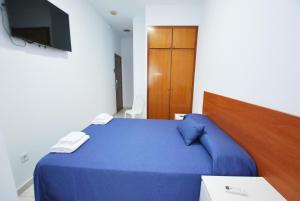Postel nebo postele na pokoji v ubytování Hotel Tres Leones