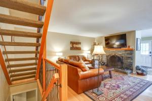 a living room with a couch and a fireplace at Ski-In Retreat with Pool Access 2 Blocks to Main St in Breckenridge