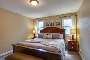 a bedroom with a large bed and two windows at Ski-In Retreat with Pool Access 2 Blocks to Main St in Breckenridge +26 photos