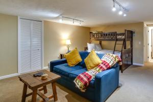 a living room with a couch and a bunk bed at Ski-In Retreat with Pool Access 2 Blocks to Main St in Breckenridge