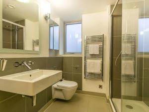 a bathroom with a sink and a toilet and a shower at Pass The Keys Gorgeous 3-bed with large roof terrace, very central in London