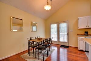 a kitchen and dining room with a table and chairs at Pet Friendly Charming Cozy Greensboro Gem! in Greensboro