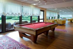a pool table in the middle of a room at Savoy Beach Hotel & Thermal Spa in Bibione