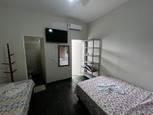 Ένα ή περισσότερα κρεβάτια σε δωμάτιο στο Pousada QDG +8 φωτογραφίες
