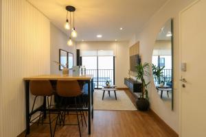 a dining room and living room with a table and chairs at Great 2BR with Balcony in the Heart of Miraflores in Lima