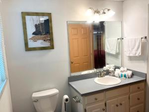 a bathroom with a sink and a toilet and a mirror at 2811 Hawthorne Dr, NE in Atlanta