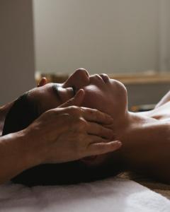 a person laying on the floor with their hands at Hotel Santa Marta in Lloret de Mar